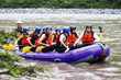 © Ammit - Prepare for adventure! A lively group of tourists readies themselves for an unforgettable whitewater rafting journey down the exhilarating Pastaza River brimming with excitement and anticipation