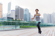 © leungchopan - Woman look at her wearable when running