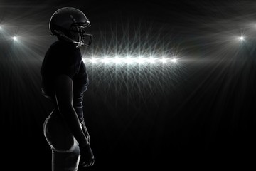 Wall Mural - Composite image of silhouette american football player