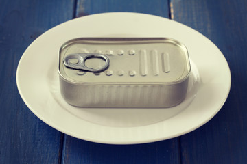 Wall Mural - canned food on blue background