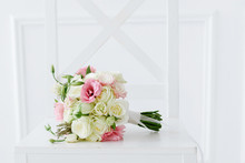Wedding Bouquet On White Chair