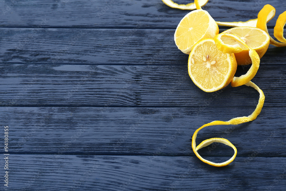 Ripe lemons on wooden table close up