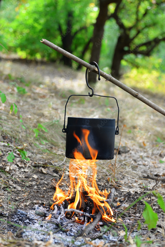 Kettle on fire in the forest
