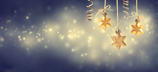Wall Mural - christmas golden star ornaments at night