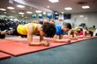 © WavebreakMediaMicro - Fit people working out in fitness class