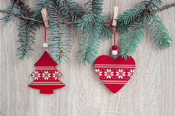 Christmas decorations hanging over wooden background