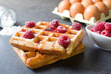 Waffles With Raspberries And Strawberry Syrup