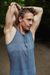 © Flamingo Images - Muscular man doing stretching exercises