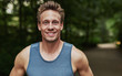 © Flamingo Images - Smiling handsome muscular young man
