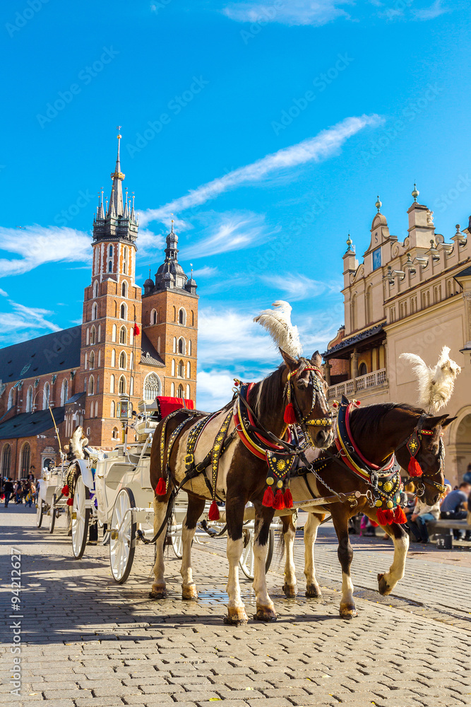 Obraz Horse carriages at main square in Krakow fototapeta, plakat
