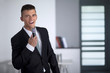 © COSPV - Successful businessman singing with a microphone in office