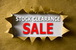 Torn brown paper with STOCK CLEARANCE SALE words