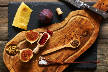 Wall Mural - Olive wood cutting board with spices and fig