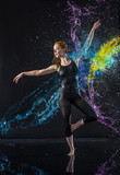 Fototapeta Sport - Female Dancer Being Splashed with Colorful Water