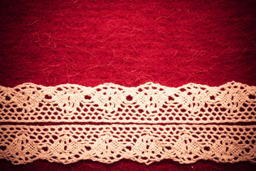 Wall Mural - Vintage white lace over red background