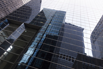 glass facade of skyscraper in new york downtown manhattan with r