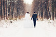 © satura_ - bride and groom in the winter woods
