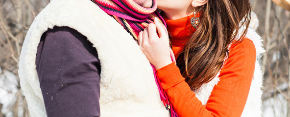 Wall Mural - Young couple hugging r in winter weather