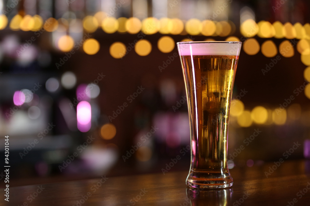 Cold beer glass on bar or pub desk