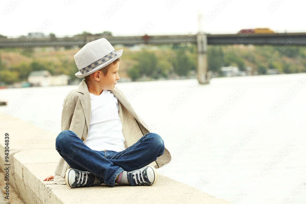 Little boy on the riverside