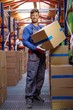 © Nejron Photo - Porter carrying boxes in a warehouse