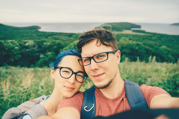 Poster - Young couple doing selfie on nature