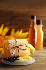 Poster - Spa treatments and sunflower on wooden background