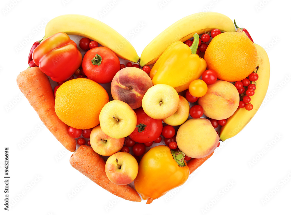 Colourful heart shaped fruit and vegetables composition isolated on white