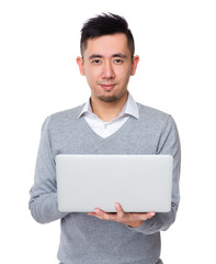 Canvas Print - Asian Young Businessman use of the notebook computer