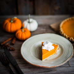 Canvas Print - Pumpkin pie on rustic wooden background