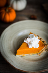 Wall Mural - Pumpkin pie on rustic wooden background