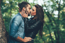Beautiful Young Woman Kissing Handsome Man