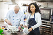 © mrcats - young girl learns to bake cakes with porfessionalnym baker