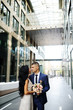 © Evgeniy Kalinovskiy - the bride and groom on the background of glass building