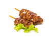 Chicken teriyaki with skewers isolated on white.