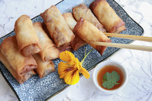 Homemade Spring Rolls Garnished With Edible Flower