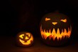 Spooky Halloween pumpkin with funny pumpkin in the dark