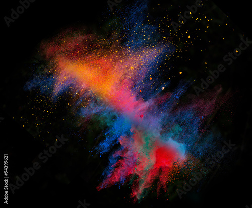 Launched colorful powder on black background