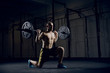© baranq - Young athlere training lunges with barbells