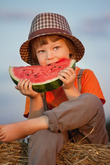 Wall Mural - boy eating watermelon