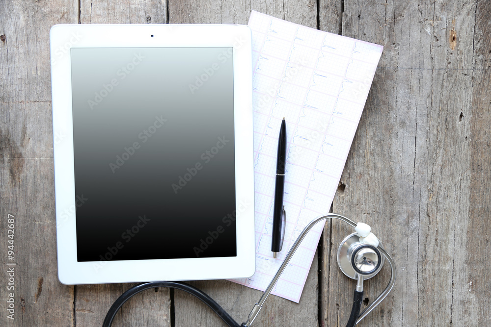 Medical tablet with screen empty screen on wooden table