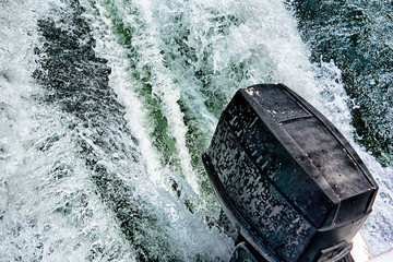 boat motor pushing water in lake