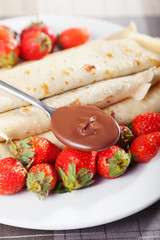 Wall Mural - Pancakes with chocolate and strawberries