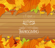 Thanksgiving leaves background on wood