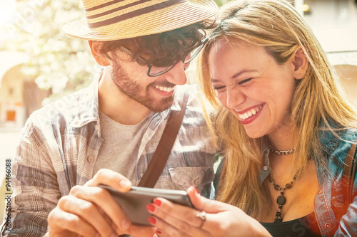 Poster Happy Couple Having Fun with a Smartphone