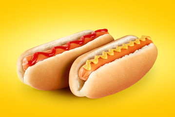 Wall Mural - Hot dogs with ketchup and mustard on a yellow background.