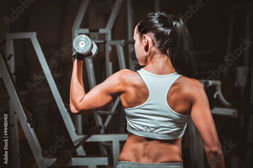 Naklejka - mata magnetyczna na lodówkę fitness woman doing exercises with dumbbell in the gym