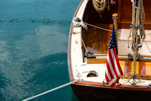 Details Of A Vintage Wooden Sailing Boat With An American Flag