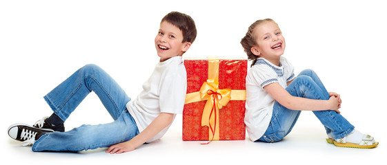 boy and girl with red gift box and golden bow - holiday object concept isolated