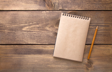 blank vintage paper notebook with pencil